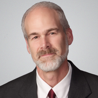 man in suit and tie poses for professional headshot